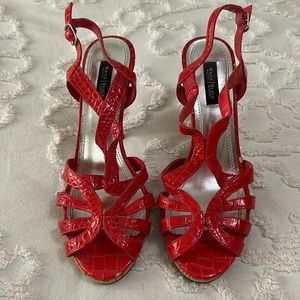 Beautiful well loved White House Black Market red heels!